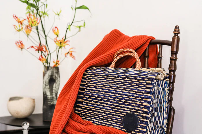 Amália handmade reed basket with genuine leather logo detail
