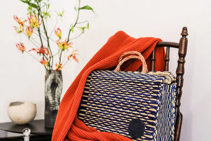 Amália handmade reed basket with genuine leather logo detail