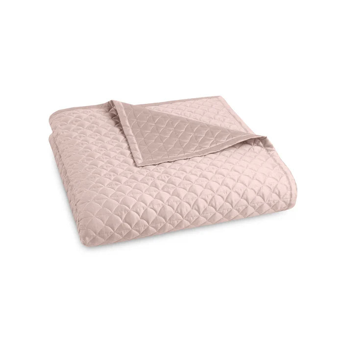 Suave quilted Egyptian cotton coverlet with elegant sateen finish