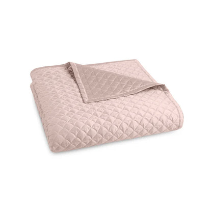 Suave quilted Egyptian cotton coverlet with elegant sateen finish