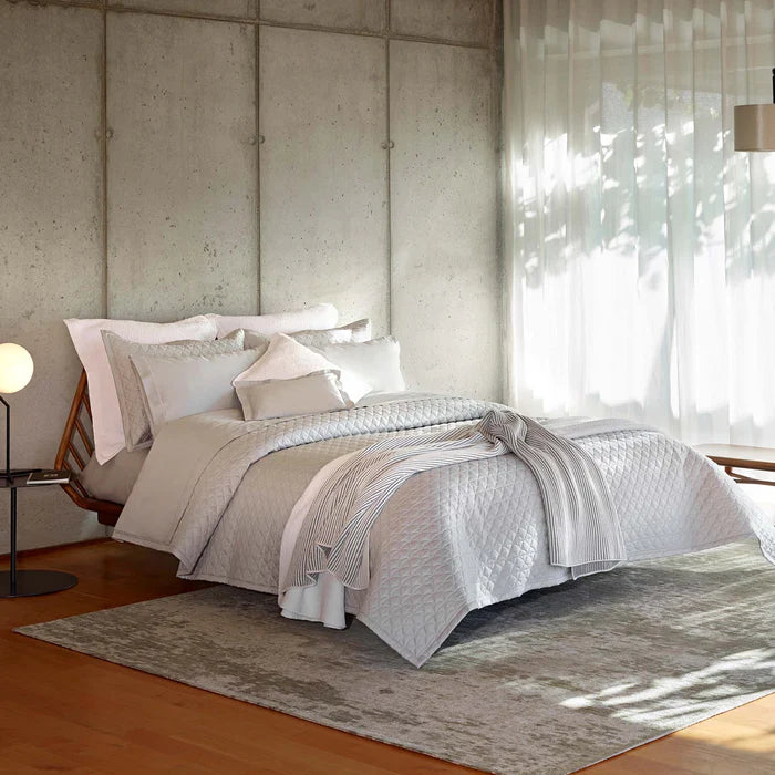 Suave quilted Egyptian cotton coverlet with elegant sateen finish