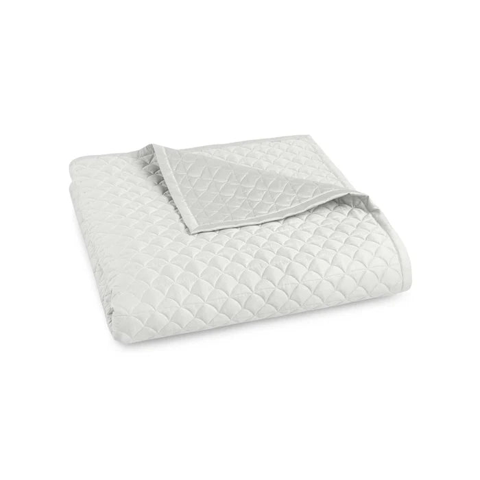 Suave quilted Egyptian cotton coverlet with elegant sateen finish
