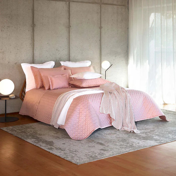 Suave quilted Egyptian cotton coverlet with elegant sateen finish