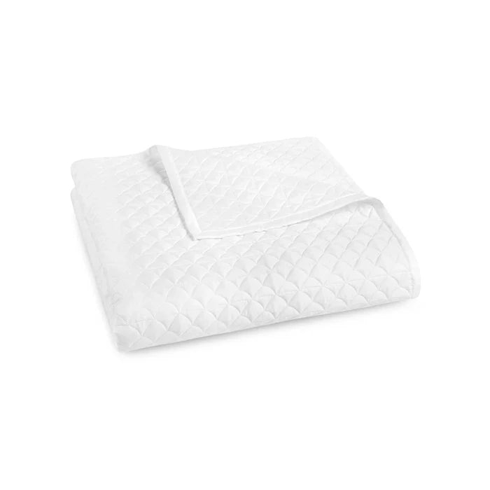 Suave quilted Egyptian cotton coverlet with elegant sateen finish