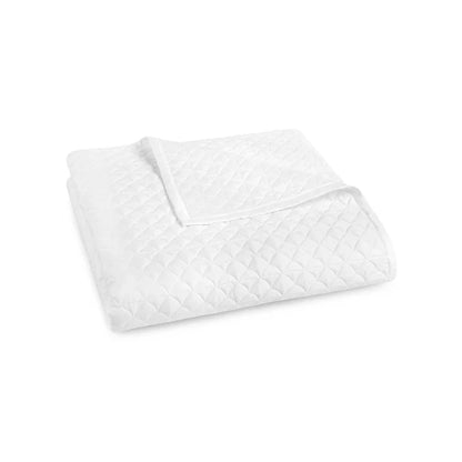 Suave quilted Egyptian cotton coverlet with elegant sateen finish