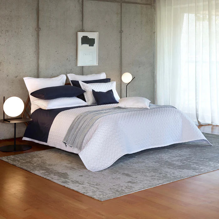 Suave quilted Egyptian cotton coverlet with elegant sateen finish
