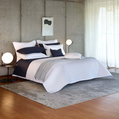 Suave quilted Egyptian cotton coverlet with elegant sateen finish
